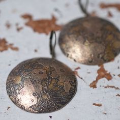 Realistic looking domed full moon earrings made with etched brass. Oxidised for an antiqued look. Very lightweight and easy to wear. Brass Moon Shaped Festival Earrings, Moon-shaped Brass Earrings For Festival, Festival Moon-shaped Brass Earrings, Bronze Etched Brass Earrings, Etched Bronze Brass Earrings, Antique Finish Brass Round Earrings, Bronze Engraved Brass Earrings, Engraved Bronze Brass Earrings, Engraved Round Brass Earrings