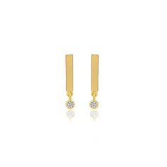 Our best-selling bar studs have been updated with a bezel set diamond drop. Handcrafted in 18-karat yellow gold, this pair of simple yet chic studs are an easy way to complement your everyday. Take your style cue from Jen and wear both in the same ear. Post backing Measures 0.5 inches in length Made with love in Los Angeles Complimentary gift wrapping provided Minimalist Gold Diamond Earrings With Bezel Setting, Minimalist Diamond Earrings With Bezel Setting, Minimalist Everyday Diamond Earrings With Bezel Setting, Minimalist Bezel Set Diamond Earrings, Minimalist Yellow Gold Diamond Earrings With Bezel Setting, Bar Studs, Bezel Set Diamond, Diamond Drops, Bezel Diamond