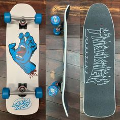 two skateboards with designs on them sitting next to each other in front of a wooden wall