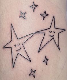 three stars with faces drawn on them