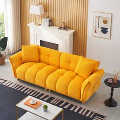 a living room filled with furniture and a fire place next to a wall mounted fireplace