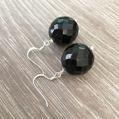 These handcrafted black onyx earrings are simply stunning! Silver fish hooks featuring a large 18mm round faceted black onyx gemstone and measuring 1.5 inches in length. Perfect for any formal occasion! Item is carefully packaged and shipped via USPS in a sturdy protective mailer. Check out more fabulous jewelry and enter my shop here: https://www.etsy.com/shop/jewelbytessyla View the positive feedback I've received from customers and check out some beautiful art prints for nursery and home at m Prints For Nursery, Abalone Earrings, Black Onyx Earrings, Black Earrings Dangle, Fish Hooks, Silver Fish, Yellow Gemstones, Jade Earrings, Onyx Earrings