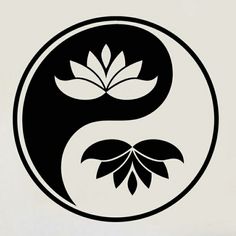 a black and white yin symbol with leaves