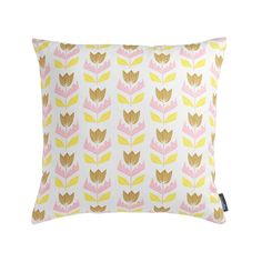 a yellow and pink pillow with leaves on it