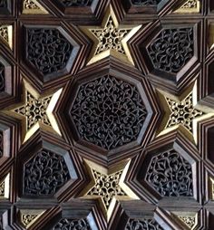 an intricately carved wooden wall panel