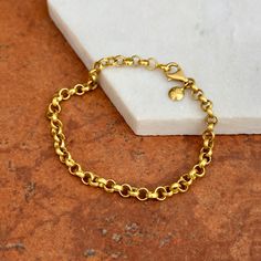 18K yellow gold solid rolo design chain link bracelet with matte-finish. 3D, round links in buttery yellow color- looks like 22K but is only 18k! SOLID, heavy, sturdy chain bracelet- perfect for daily wear. Clasp is shorter on any of the round links! Choose your length: 7.5" or 8" Shown on a 6" wrist Links measure: 4.8mm Solid links Large lobster clasp Stamped 18K Weight: 11.39 grams (7.5" length) OR 12.99 grams (8" length) Made in Italy Gold Oval Link Chain Bracelet With Rolo Chain, Gold Chain Bracelet With Rolo Chain And Oval Link, Gold Rolo Chain Bracelet With Oval Links, Gold Rolo Chain Bracelet, Saint Jewelry, White Gold Bracelet, White Gold Necklaces, White Gold Earrings, Yellow Gold Bracelet