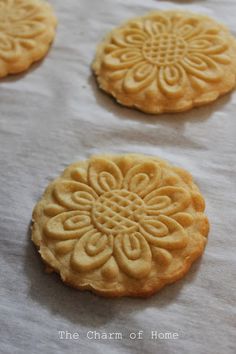 four cookies are sitting on top of a table