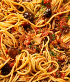 pasta with olives and meat sauce in a bowl