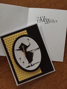 a close up of a greeting card on a wooden table with envelopes and paper