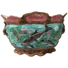 a bowl with fish painted on it