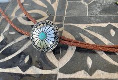 "This awesome bolo tie has a southwestern design and turquoise centerpiece. Our bolos pair nicely with many of our belt buckles! They make wonderful gifts. The western bolo tie rope length is 100cm(39\")" Artisan Turquoise Bolo Ties With Concho, Adjustable Turquoise Bolo Ties For Western-themed Events, Southwestern Concho Bolo Tie For Ranch, Southwestern Bolo Ties With Concho For Ranch, Southwestern Adjustable Turquoise Bolo Ties, Southwestern Concho Bolo Tie As Gift, Adjustable Southwestern Bolo Tie, Bohemian Bolo Tie With Concho, Bohemian Adjustable Bolo Ties With Concho