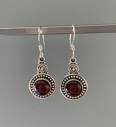 Sterling silver oval Garnet earrings Matching necklace  available. Gift box available for purchase. Search GIFTBOX Garnet Gemstone Earrings As A Gift, Garnet Round Earrings For Anniversary, Garnet Earrings For Anniversary, Silver Garnet Birthstone Earrings, Anniversary Garnet Round Earrings, Round Garnet Earrings For Anniversary, Nickel-free Round Garnet Jewelry, Garnet Jewelry With Matching Round Earrings, Nickel Free Garnet Earrings Gift