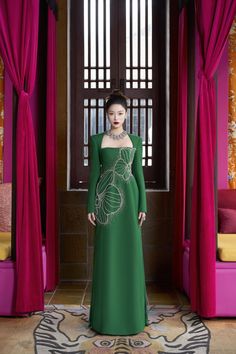 The epitome of luxury and elegance. This Ao Dai is the perfect blend of comfort and sophistication. The smooth velvet and soft satin will make you feel like royalty, while the flattering sheath silhouette highlights your figure. Elevate your style with Vivacy. Length: 150cm (Ao Dai), 110cm (Pants) Luxury Festive Evening Dress With Fitted Bodice, Luxury Satin Gown, Luxury Festive Gown With Fitted Bodice, Luxury Long Sleeve Silk Gown, Luxury Fitted Velvet Gown, Luxury Festive Gown For Banquet, Luxury Floor-length Evening Dress, Luxury Green Gown For Banquet, Luxury Long Sleeve Satin Evening Dress