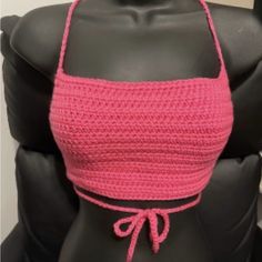 a woman's pink crop top on a mannequin