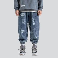 Step out in style with the 2023 Spring-Summer Collection's medium-waist denim joggers! Crafted with premium denim. these joggers feature a street-style distressed pattern and drawstrings closure. making them the perfect blend of contemporary fashion and nostalgic grunge.Why They're Your Next Summer Staple: Grunge Galore: Inspired by the iconic '90s grunge movement. these joggers exude an effortlessly cool attitude. Distinctive Paint Pattern: Expertly crafted with a unique street-style paint patt Casual Jeans With Elastic Waistband For Streetwear, Denim Pants With Elastic Waistband For Streetwear, Casual Denim Blue Pants For Streetwear, Sporty Denim Jeans For Streetwear, Casual Denim Pants For Streetwear, Trendy Baggy Joggers For Streetwear, Casual Graphic Print Pants For Streetwear, Trendy Baggy Summer Joggers, Sporty Streetwear Cotton Jeans