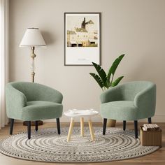 two green chairs sitting on top of a rug next to a table with a potted plant