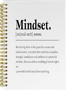 a spiral notebook with the words mindset in black and white writing on top of it