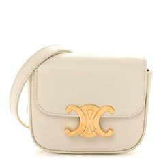 This is an authentic CELINE Shiny Calfskin Mini Triomphe in Rice. This chic shoulder bag is crafted of calfskin leather in white. The bag features an adjustable leather shoulder strap, gold hardware, and a gold snap lock. This opens to a white leather interior with a patch pocket. Classic White Shoulder Bag With Gold-tone Logo, White Crossbody Shoulder Bag With Gold-tone Logo, Classic White Bags With Gold-tone Logo Plaque, Chic White Bag With Gold-tone Logo Plaque, White Crossbody Bag With Gold-tone Logo Plaque, Designer White Bags With Gold-tone Logo Plaque, Designer White Bags With Gold-tone Logo, Chic Everyday Flap Bag With Gold-tone Logo Plaque, Chic Flap Bag With Gold-tone Logo