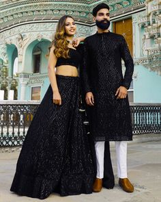 Menswear:- Readymade Faux Georgette Kurta set in Black This Chinese Collar and Full Sleeves attire is Enhanced with Pockets, Resham and Sequins Work Lehenga Choli:-Readymade Faux Georgette Lehenga in Black This attire with Shantoon and Cotton Lining is Enhanced with Fancy Tassels, Resham and Sequins Work Available with a Sleeveless Faux Georgette Black Choli Crafted in Round Neck and a Faux Georgette Dupatta in Black The Choli and Lehenga Lengths are 14 and 42 inches respectively Please refer re Black Sequin Kurta Men, Black Palazzo Set For Eid Reception, Black Palazzo Set For Reception During Eid, Traditional Black Palazzo Set For Reception, Black Bollywood Palazzo Set For Reception, Bollywood Black Palazzo Set For Reception, Black Sherwani For Party And Festivals, Black Bollywood Style Palazzo Set For Party, Black Bollywood Palazzo Set For Party