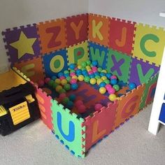 a room with toys and letters on the floor