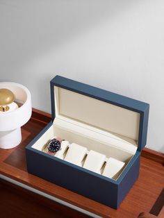 Meticulous about craftsmanship, Pinel et Pinel handmakes everything at its dedicated workshops in Paris. This 'Tarmac' watch box is made from full-grain leather with four sections to keep your timepieces secure. Classic Blue Rectangular Watch Accessories, Elegant Blue Watch Accessories For Gift, Elegant Blue Watch Accessories As Gift, Elegant Blue Rectangular Watch Accessories, Elegant Blue Rectangular Watch, Designer Blue Watch For Gift, Designer Blue Watch As Gift, Designer Blue Watches As Gift, Designer Blue Watches Gift