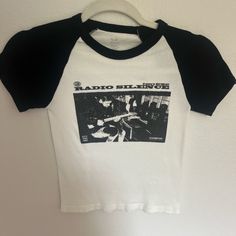 One Size Never Worn Retro Black Tops With Text Print, Retro Black Tops With Logo Print, Black Retro Top With Logo Print, Retro Black Tops With Graphic Design, Retro Black Top With Graphic Design, Brandy Melville Shirts, Radio Silence, Baby Graphic Tees, Black And White Baby