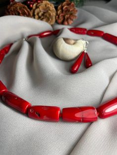 Beautiful Red Coral, when you wear this set, you wear vitality, energy and ambition. If you're looking to give off a Wonder Women Kind of air, red coral is a perfect option. Natural color of passion.  Each set comes in a beautiful box, perfect for gift giving! Gemstone: Coral Weight: Necklace 96.6 gr (3.405 oz)                Earrings    5.8 gr (0,205 oz) Lenght: Necklace                 Earrings      The Care for Pearl Jewelery With special atteintion and care, your pearl jewelery will last a l Red Jewelry Set, Pearl Jewelery, Wonder Women, Red Necklace, Red Jewelry, Coral Necklace, Earrings Red, Wedding Jewelry Sets, Necklace And Earrings