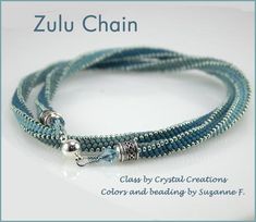 a blue beaded bracelet with silver beads