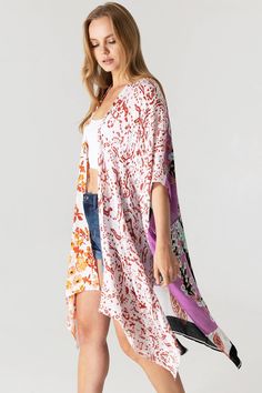 Boho print kimono with contrasting prints. Ultra light, draping open-front. Light and billowy silhouette, perfect for effortless layering. CARE | Hand Wash Cold or Dry Clean CONTENTS | 100% Viscose MEASUREMENTS | 36"/91 cm Top to Bottom (Size O/S) MODEL | 5'8 - wearing O/S IMPORTED Multicolor Printed Wrap Cover-up, Flowy Open Front Printed Cover-up, Multicolor Print Kimono For Spring Beach Cover-up, White V-neck Kimono For Daywear, Spring Kimono With Abstract Print, White V-neck Kimono For Day Out, Summer Kimono With Abstract Print And Kimono Sleeves, Spring Daywear Wrap Kimono, Summer Kimono With Abstract Print