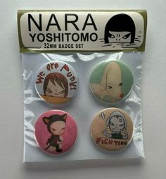 three badges with cartoon characters on them