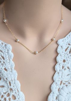 Intricate and delicate, this necklace is made with 14kt gold filled cable chain and lustrous hand wired freshwater pearls.  Please note that all metal material is gold filled.  Gold filled is high quality and lasting, not to be confused with gold plated brass. You may select your length when you add the item to your cart.  Note: most chokers are 14 or 15 inches.  Short necklaces are typically 16 inches. Standard necklaces are 17 or 18 inches.   The necklace is finished with a gold filled lobster Elegant Gold Plated Wire Wrapped Necklaces, Delicate Gold Wire-wrapped Pearl Necklace, Delicate Gold Wire Wrapped Pearl Necklace, Dainty Gold Pearl Necklace With Delicate Chain, Dainty Pearl Necklace With Wire Wrapped Detail, Dainty Pearl Necklace With Wire Wrapping, Dainty Pearl Wire Wrapped Necklaces, Elegant 14k Gold-filled Wire Wrapped Necklace, Elegant 14k Gold Filled Wire Wrapped Necklace