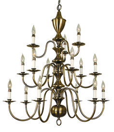 a large chandelier with many lit candles hanging from it's center point