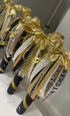 Black and gold cheer spirit sticks Cheerleader Spirit Sticks, Spirit Stick Ideas Diy Cheer, How To Make A Spirit Stick Cheer, Cheer Sticks Spirit Diy