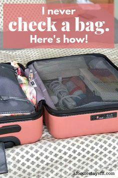 two pink suitcases sitting on top of a bed with the words never check a bag here's how