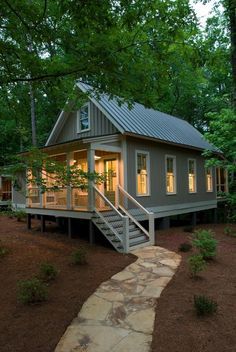 a small house with stairs leading to it