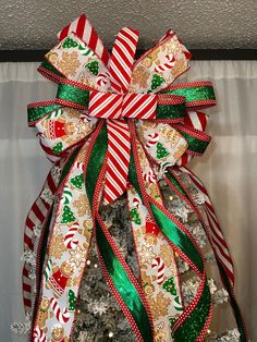 a christmas tree decorated with ribbons and candy canes