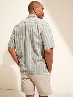 COTTON-VISCOSE LAWN: Our lightest shirt just in time for summer, this cotton-viscose shirt is made in a breezy fabric that’s super soft.  Camp collar.  Button front.  Straight hem.  Relaxed fit.  Short sleeves.  Hits at the hip.  Center back length Casual Short Sleeve Shirt With Placket For Vacation, Casual Beach Tops With Placket, Relaxed Fit Beach Tops With Placket, Unstructured Button-up Beach Shirt, Unstructured Collared Shirt For Vacation, Casual Vacation Tops With Placket, Unstructured Collared Tops For Beach, Classic Relaxed Fit Beach Tops, Relaxed Button-up Shirt For Vacation