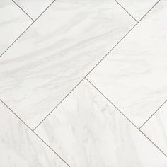 a white marble tile floor that looks like herringbones