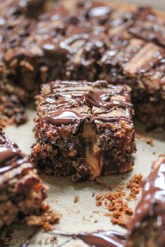 a close up of some brownies with chocolate on top