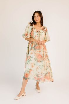 this vintage-inspired puff sleeve maxi dress is guaranteed to be your new go-to. it features a dainty ruffle neckline, dramatic puff sleeves, + a chic muted abstract floral pattern. with its relaxed silhouette + flowy shape, it’s the perfect maxi dress to pair with your favorite heels, boots, sandals, or sneaks. watercolor floral // scoop neckline, front tie, dramatic puff sleeves, pockets, contrast stitching on collar, lined model is 5'8" + wearing a small measurements are approximate + taken w Spring Midi Dress With Ruffles And Balloon Sleeves, Puff Sleeve Maxi Dress With Ruffles For Garden Party, Feminine Puff Sleeve Midi Dress, Billowy Midi Dress With Ruffles And Puff Sleeves, Puff Sleeve Dress With Lantern Sleeves For Garden Party, Spring Maxi Dress With Puff Sleeves And Gathered Neckline, Puff Sleeve Dress With Ruffles For Garden Party, Flowy Puff Sleeve Maxi Dress For Daywear, Flowy Maxi Dress With Puff Sleeves For Daywear