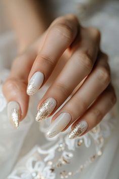 Explore 101 beautiful gold wedding nail designs for a glamorous wedding look. #GoldWeddingNails #WeddingNailArt #BridalInspo Click to discover more! Bridal Nails White And Gold, White And Gold Nails With Designs, White With Gold Glitter Nails, Christmas Nails Gold And White, Bridal Nails With Gold, White Nails Gold Design, White Nails Gold Accent, White Gold Christmas Nails, Bride Nails Wedding Elegant Gold