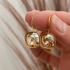 Adorable, handmade champagne diamond cushion cut / square Swarovski crystal earrings in golden shadow with a gold plated drop ear wire.   These are the perfect rhinestone bridesmaids earrings - and all Sela + Sage jewelry comes in matte black gift boxes, making the perfect bridesmaids gift! This design is also available in silver: https://www.etsy.com/listing/179648850/cushion-cut-silver-swarovski-crystal Sela+Sage is a hand crafted jewelry line with all pieces designed and made in Lake Oswego, Sage Jewelry, Square Crystal Earrings, Bridesmaids Earrings, Golden Shadow, Pretty Jewelry Necklaces, Square Crystal, Lake Oswego, Swarovski Crystal Earrings, Champagne Diamond