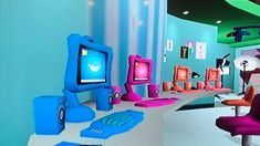 a computer room filled with lots of colorful furniture