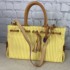 Nwot? Dooney And Bourke Yellow And White Tassel Tote. Small Rub Marks Noted On Exterior. Corners And Inside A Pristine! Spring Yellow Canvas Bags, Yellow Leather Handle Shoulder Bag For Spring, Spring Yellow Shoulder Bag With Leather Handles, Casual Yellow Bag With Leather Handles, Yellow Canvas Shoulder Bag With Handles, White Tassel, Dooney And Bourke, Medium Tote, Dooney & Bourke Bags