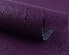 purple leather textured with silver stitching