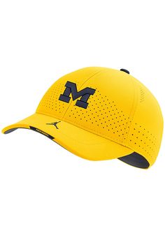 This Michigan Wolverines Yellow Adjustable Hat features a front embroidered team logo on a structured Dri-Fit polyester crown. Nike Sideline L91 Dri-Fit Hat, Front embroidered team logo, Performance Dri-Fit polyester material, Strategic crown perforations to help keep cool, Swoosh on bill, As worn by teams on the sidelines, Polyester, Wipe clean with cloth or cleaning kit, 4 Collegiate Sports Trucker Hat With Curved Brim, Collegiate Trucker Hat With Curved Brim For Sports, Nike Baseball Cap With Curved Brim For Sports, Nike Sports Hats With Embroidered Logo, Nike Curved Brim Baseball Cap For Sports, Nike Breathable Baseball Cap For Sports, Collegiate Sports Baseball Cap Six-panel, Collegiate Six-panel Baseball Cap For Sports, Collegiate Sports Baseball Cap