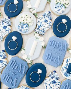 blue and white decorated cookies with the words miss to mrs written on them, surrounded by wedding rings