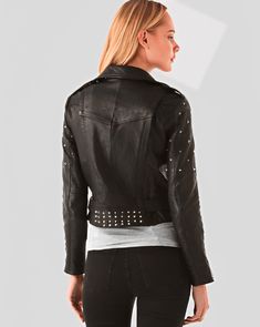 Women's Studded Biker Leather Jacket In Black This women's studded biker leather jacket is made from real leather and features two side zip pockets, notched collar with snap button closure, studs at the front and back. The belt on this jacket is black leather and it can be worn on either side. Outer Shell: Real Leather Leather Type: Cowhide Leather Finish: Semi-aniline Inner Shell: Viscose LiningWomen's Studded Biker Leather Jacket Features: Belted Waist & High-Quality Studs. Each Securely Added By Hand Closure Style: Zipper Collar Style: Notch Collar With Snap Button Cuffs Style: Zip Inside Pockets: One Outside Pockets: Two Side Zip Pockets Color: Black Studded Leather Jacket For Biker Events In Fall, Winter Biker Leather Jacket With Studs, Winter Leather Biker Jacket With Studs, Winter Leather Studded Biker Jacket, Studded Leather Biker Jacket For Winter, Studded Biker Leather Jacket, Winter Moto Leather Jacket With Studs, Moto Leather Jacket With Studs For Winter, Fitted Biker Outerwear With Studs