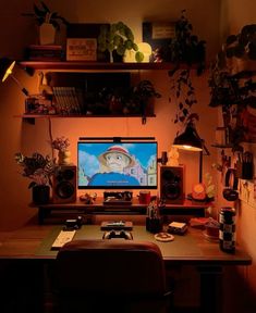 a desk with a computer monitor and speakers on it