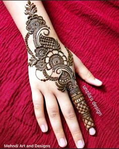 the hand is decorated with henna designs